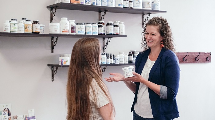 Doctor showing supplements helping with Functional Medicine
